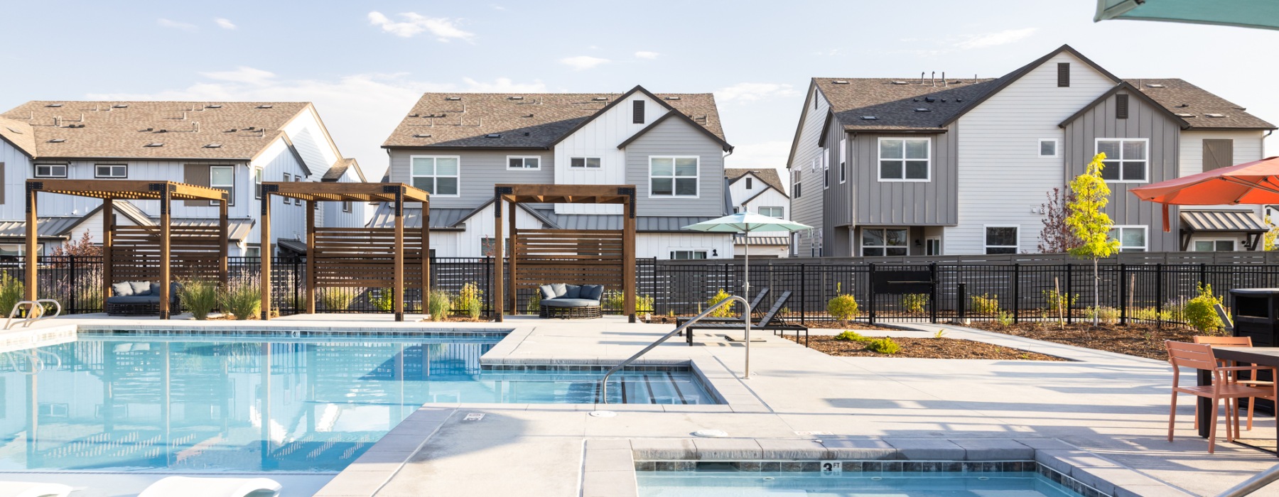 pool and hot tub with large deck and cabanas