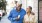 older couple walks down city sidewalk while holding ice cream cones