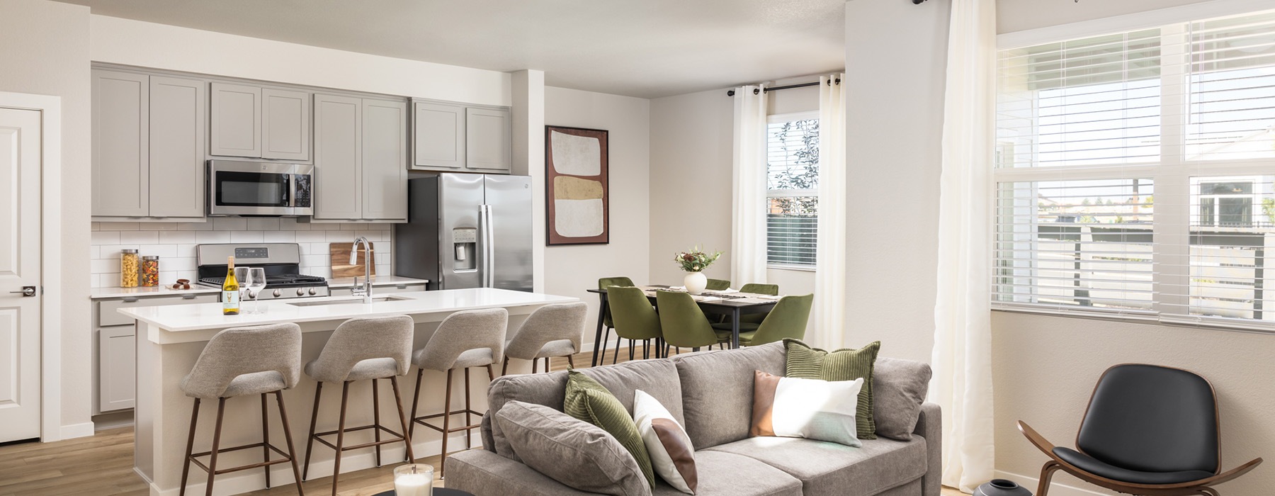 a kitchen and living room with windows